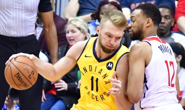 Indiana Pacers forward Domantas Sabonis posts up Washington Wizards forward Jabari Parker during the Pacers' 119-112 win at Capital One Arena in D.C. on Feb. 23. (John E. De Freitas/The Washington Informer)