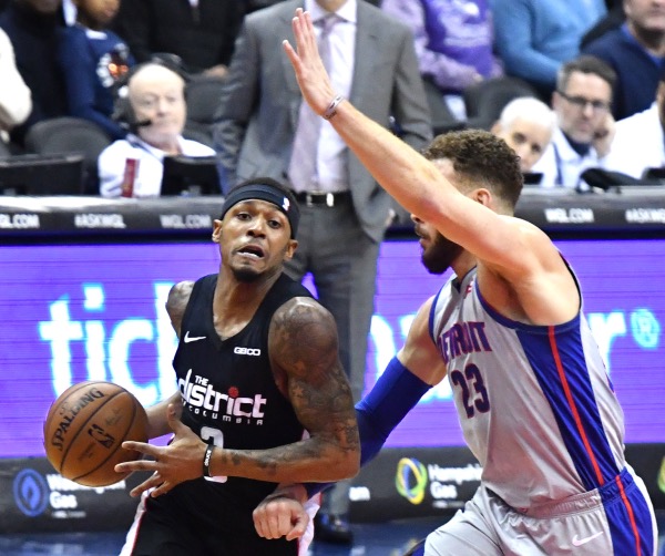 Washington Wizards guard Bradley Beal drives against Detroit Pistons forward Blake Griffin during the Wizards' 101-87 win at Capital One Arena in D.C. on Jan. 21. (John E. De Freitas/The Washington Informer)