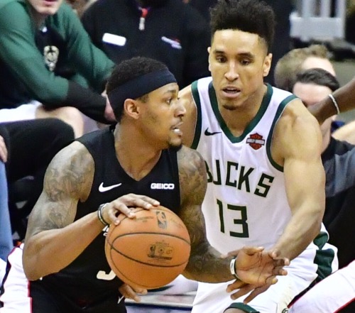 Washington Wizards guard Bradley Beal drives against Milwaukee Bucks guard Malcolm Brogdon during the Wizards' 113-106 win at Capital One Arena in D.C. on Jan. 11. (John E. De Freitas/The Washington Informer)