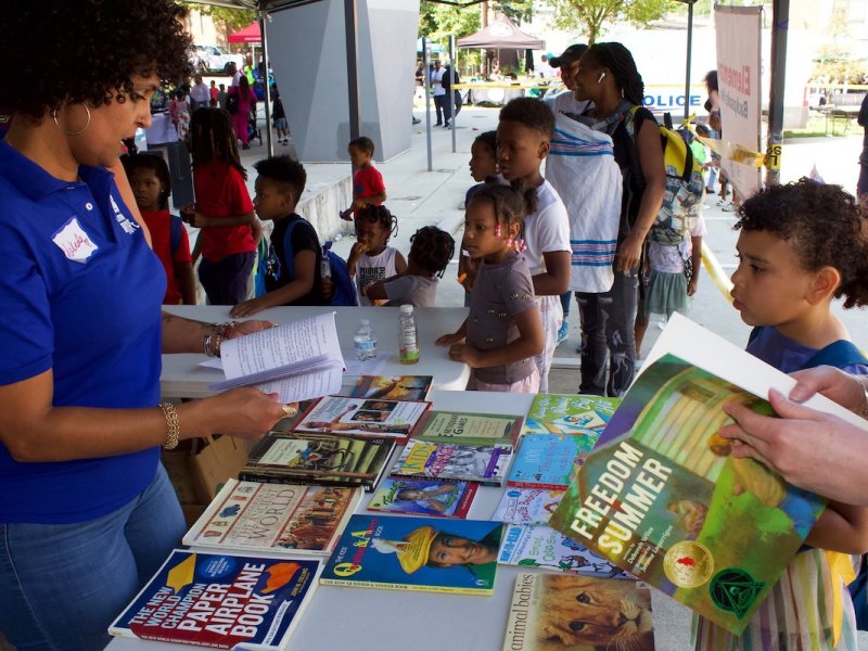 Hundreds of books, made possible by volunteers and donors, were gifted to students. (Courtesy of Mark Mahoney)