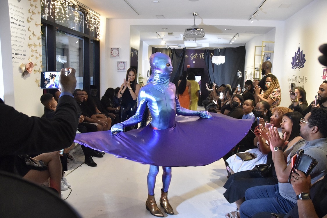 An outfit designed by Consuela Wintz portraying “social distance” is featured at a fashion show June 12 at Café Crystal by Faith2Felicity at National Harbor. (Robert R. Roberts/The Washington Informer)