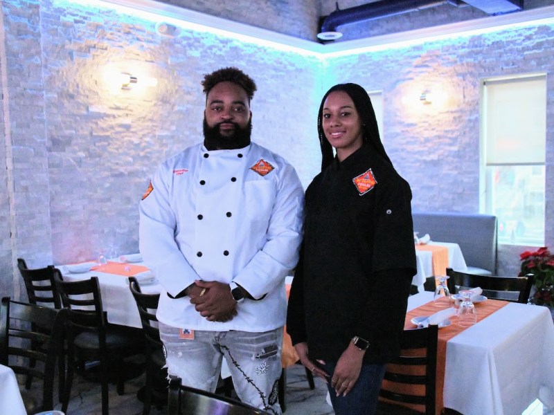 Lead staff at DC Capitol Square Bar and Grill on East Capitol Street are Managing Partner and General Manager Clayton Rosenberg (left) and Folasade “Sade” Ogunfowora, who oversees compliance matters. They are in a private room at the restaurant that can be reserved. (Anthony Tilghman/The Washington Informer)