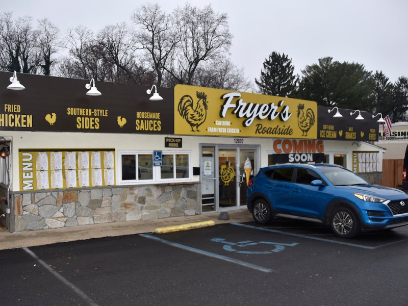 With a huge yellow sign, you can't miss Fryer's, the walk-up, takeout eatery recently reopened in Silver Spring, Md. (Robert R. Roberts/The Washington Informer)