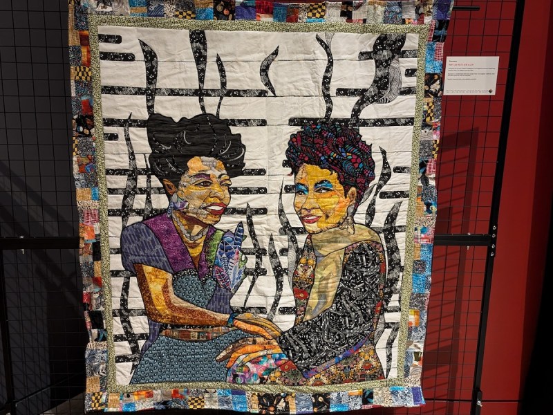 One of the first seen upon entering “New Standards: Shifting The Narrative” is a quilt titled “Mary Lou Meets Geri Allen” by the artist Ramsess. The quilt honors Mary Lou Williams and Allen, both pianists and composers. (Brenda C. Siler/The Washington Informer)