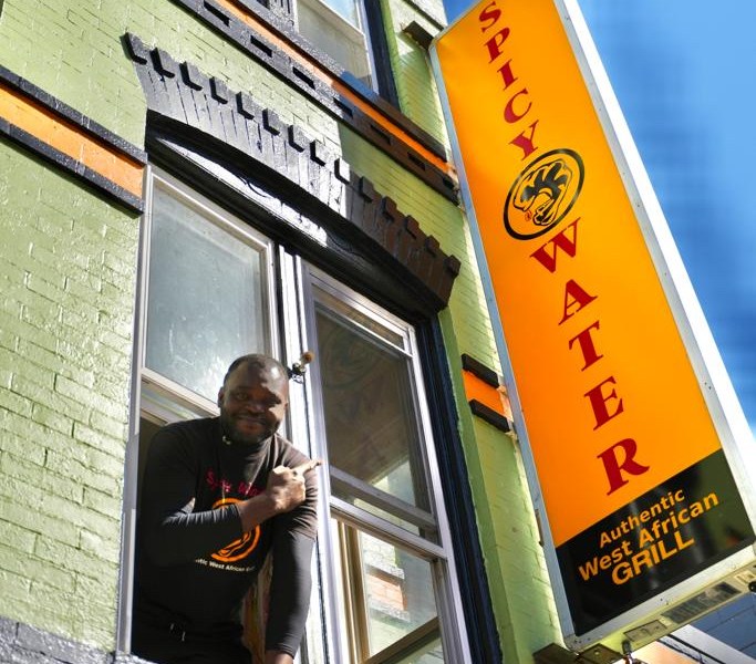 Duraine Kouassi, owner of Spicy Water African Grill, at his colorful restaurant at 2019 11th Street NW, a few steps from U Street (Courtesy of Spicy Water)
