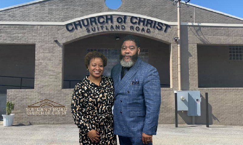 Minister Deon Booker (right) and his wife Sophia Booker pose in front of Suitland Road Church of Christ. (Courtesy photo)