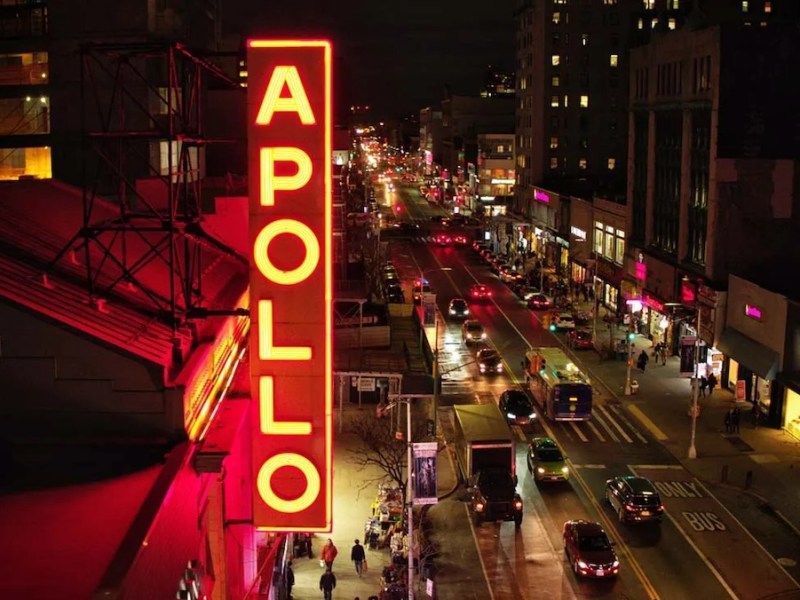 The famed Apollo Theater's neon sign shines over 125th Street in New York's Harlem neighborhood. (Courtesy of HBO via AFI Docs Film Festival)