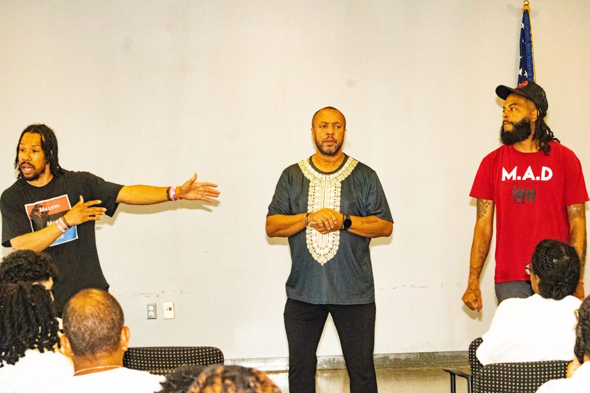 Chris Thomas from Million Man Vote, Ambrose Lane Jr. (Health Alliance Network), and Prince Hamm from Making A Difference (M.A.D.) speak to students attending the International Overdose Awareness Day event. (Cleveland Nelson/The Washington Informer)