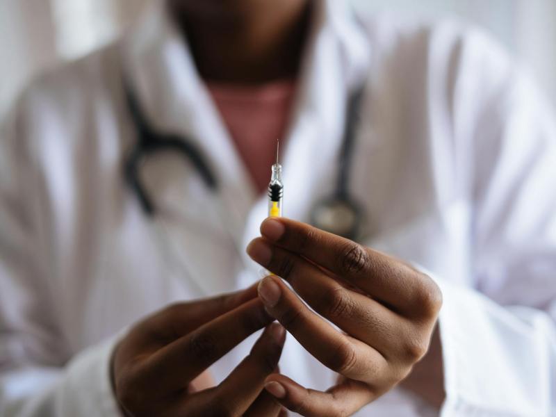 person holding injection