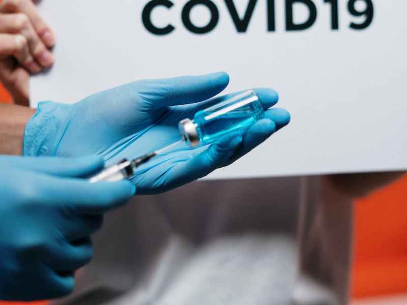 person holding syringe