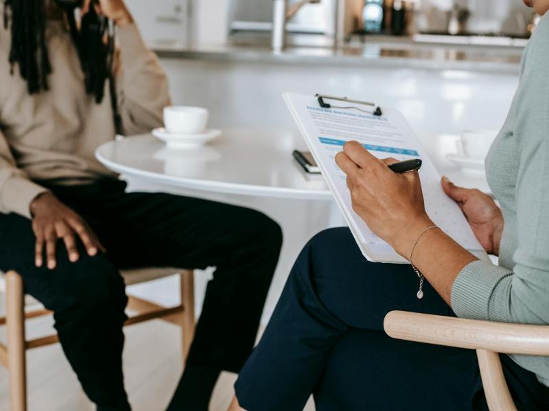 crop faceless multiethnic interviewer and job seeker going through interview