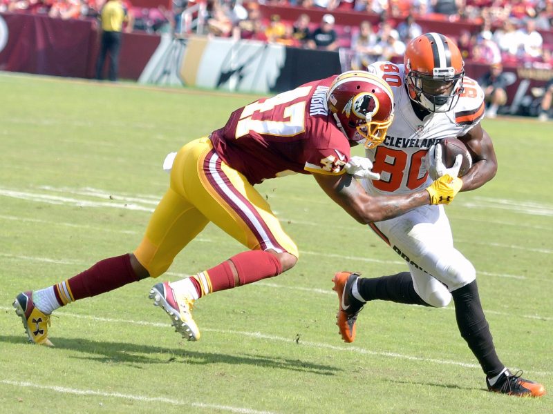 Washington Redskins cornerback Quinton Dunbar tackles Cleveland Browns wide receiver Ricardo Louis during the Redskins' 31-20 win at FedEx Field in Landover, Maryland, on Sunday, Oct. 2. /Photo by John E. De Freitas